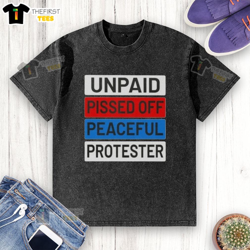 top-unpaid-pissed-off-peaceful-protester-washed-t-shirt Top unpaid peaceful protester wearing a washed t-shirt, expressing frustration during a demonstration for social change.