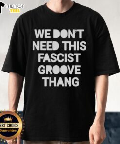 Alt Text: Top We Don't Need This Fascist Groove Thang T-Shirt featuring bold graphic design and vibrant colors, perfect for statement wear.