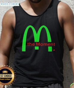 Charli XCX wearing the Awesome Charli XCX The Moment Tank Top, showcasing a stylish and trendy look.