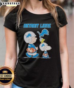 Alt Text: Awesome Detroit Lions X Snoopy and Charlie Brown ladies tee featuring vibrant graphics and team colors.