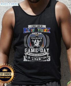 Alt Text: Woman wearing a Raiders football tank top, showcasing team spirit for Las Vegas Raiders on game day in New York.