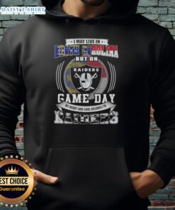 North Carolina fan wearing a Las Vegas Raiders hoodie, showcasing team spirit on game day.