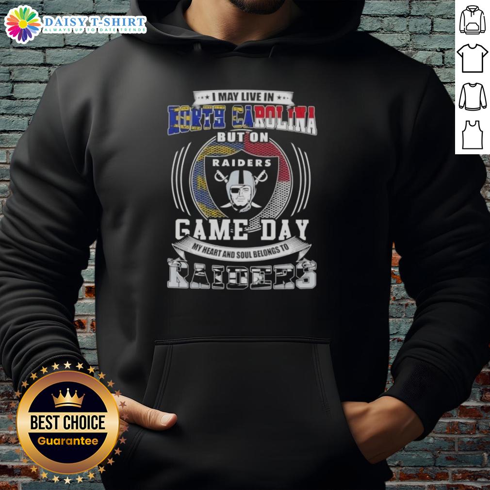 Awesome I May Live In North Carolina But On Game Day My Heart And Soul Belongs To Las Vegas Raiders Hoodie North Carolina fan wearing a Las Vegas Raiders hoodie, showcasing team spirit on game day.