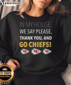 Awesome sweatshirt featuring 'In My House We Say Please, Thank You, and Go Chiefs' design, perfect for Chiefs fans.