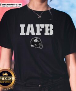 Alt Text: Iowa Hawkeyes IAFB Reliaquest Bowl Champions 2025 helmet logo on a women's tee shirt, showcasing team spirit.