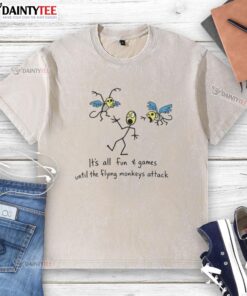 Awesome 'It's All Fun and Games Until the Flying Monkeys Attack' washed t-shirt featuring a fun graphic design.
