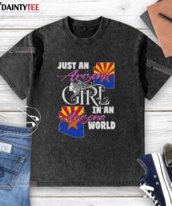 Arizona girl wearing a washed t-shirt with 'Just an Arizona Girl in an Arizona World' design, showcasing local pride.