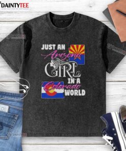 Awesome Just An Arizona Girl In A Colorado World washed t-shirt displayed on a rustic wooden background.