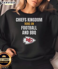 Awesome Kansas City Chiefs sweatshirt featuring 'Kingdom Runs On Football And BBQ' design, perfect for fans.