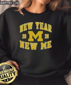 Alt Text: Awesome Michigan Wolverines Football New Year New Me 2026 logo sweatshirt featuring bold colors and sporty design.