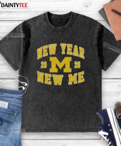 Alt Text: Awesome Michigan Wolverines Football New Year New Me 2026 logo on a washed t-shirt, perfect for fans.