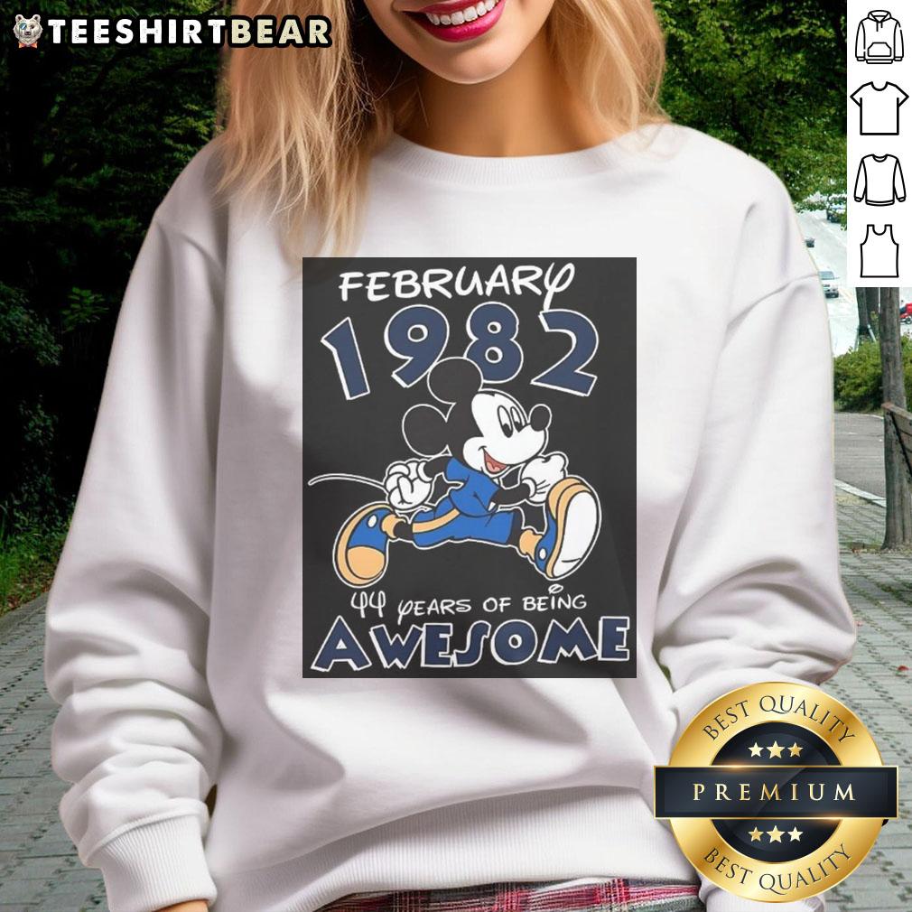 awesome-mickey-mouse-february-1982-44-years-of-being-awesome-sweatshirt Alt Text: Awesome Mickey Mouse February 1982 sweatshirt celebrating 44 years of being awesome with vibrant design and colors.