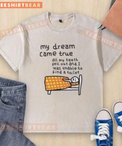 Funny washed t-shirt featuring 'My Dream Came True' with a humorous design about losing teeth and toilet troubles.