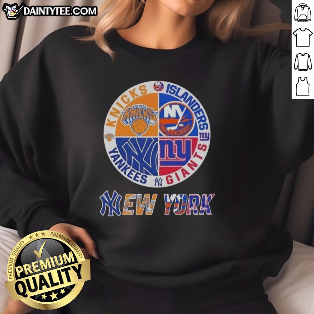 awesome-new-york-city-sports-knicks-islanders-giants-yankees-logos-combine-sweatshirt Alt Text: Awesome New York City Sports sweatshirt featuring Knicks, Islanders, Giants, and Yankees logos in a stylish design.