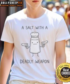 Alt Text: Awesome Salt holding two guns, wearing a Gun A Salt With A Deadly Weapon T-shirt, showcasing a bold graphic design.