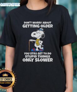 Alt Text: Snoopy graphic tee with quote: 'Don't worry about getting older, you still get to do stupid things, only slower.'