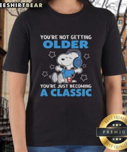 Alt Text: Awesome Snoopy tee for ladies with 'You're Not Getting Older, You're Just Becoming A Classic' design.