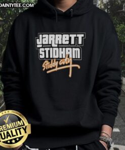 Alt Text: Jarrett Stidham wearing an Awesome Stiddy City GTA Vice City hoodie, showcasing Denver Broncos style.