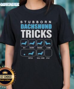 Awesome stubborn Dachshund performing tricks on a ladies tee, showcasing playful canine spirit and unique style.