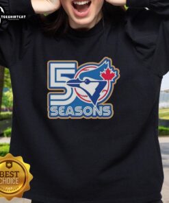 Alt Text: Awesome Toronto Blue Jays 50 Seasons logo sweatshirt featuring vibrant team colors and stylish design.