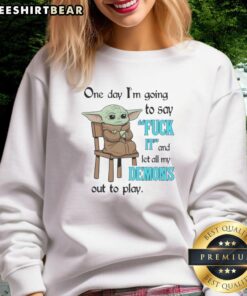 Cute Baby Yoda sweatshirt with playful quote about letting demons out to play, perfect for fans of Star Wars and cozy fashion.