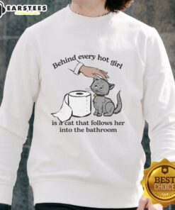 Alt Text: Cute sweatshirt featuring the phrase 'Behind Every Hot Girl Is A Cat' with a playful design, perfect for cat lovers.