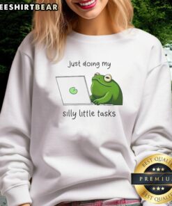 Cute frog wearing 'Just Doing My Silly Little Tasks' sweatshirt, showcasing playful design and vibrant colors.