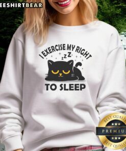Cute cat sweatshirt featuring 'I Exercise My Right To Sleep' slogan, perfect for cozy lounging and cat lovers.
