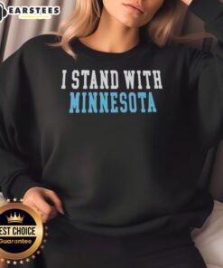 Cute I Stand With Minnesota sweatshirt in a cozy setting, perfect for showing support and style in chilly weather.