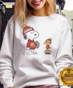 Alt Text: Cute Kansas City Chiefs Snoopy and Woodstock football NFL sweatshirt featuring vibrant colors and playful design.