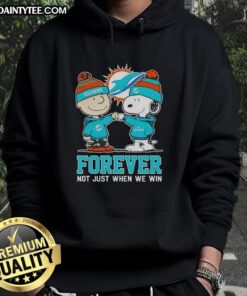 Alt Text: Cute Peanut Snoopy and Charlie Brown on Miami Dolphins hoodie, celebrating fandom with Forever, Not Just When We Win slogan.