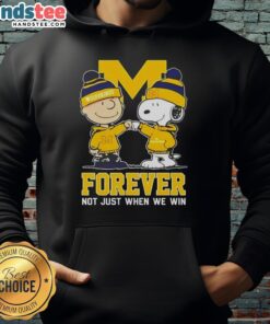 Alt Text: Cute Peanut Snoopy and Charlie Brown hoodie featuring Michigan Wolverines logo, perfect for fans celebrating all wins.