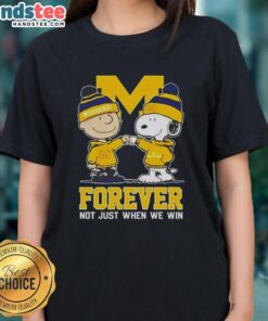 Adorable Snoopy and Charlie Brown graphic on a Michigan Wolverines ladies tee, celebrating team spirit year-round.
