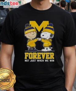 Alt Text: Cute Peanut Snoopy and Charlie Brown on a Michigan Wolverines Forever T-Shirt, perfect for fans not just when they win.
