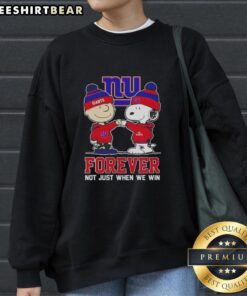 Cute Peanut Snoopy and Charlie Brown on a New York Giants sweatshirt, celebrating fandom all year round.