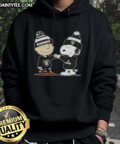 Alt Text: Cute Peanuts Charlie Brown and Snoopy fist bump in Las Vegas Raiders football hoodie, perfect for fans and collectors.