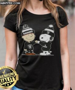 Alt Text: Cute Peanuts Charlie Brown and Snoopy fist bump in Las Vegas Raiders football ladies tee design.