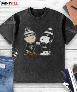 Alt Text: Cute Peanuts Charlie Brown fist bump with Snoopy in Las Vegas Raiders football washed t-shirt design.