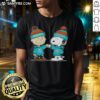 Alt Text: Cute Peanuts Charlie Brown and Snoopy fist bump on Miami Dolphins football T-shirt, perfect for fans.