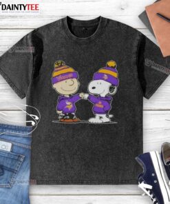 Alt Text: Cute Peanuts Charlie Brown and Snoopy fist bump in Minnesota Vikings football washed t-shirt design.