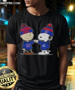 Alt Text: Cute Peanuts Charlie Brown fist bump with Snoopy on New York Giants football T-shirt, perfect for fans.