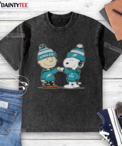 Alt Text: Cute Peanuts Charlie Brown and Snoopy fist bump in Philadelphia Eagles football washed t-shirt design.
