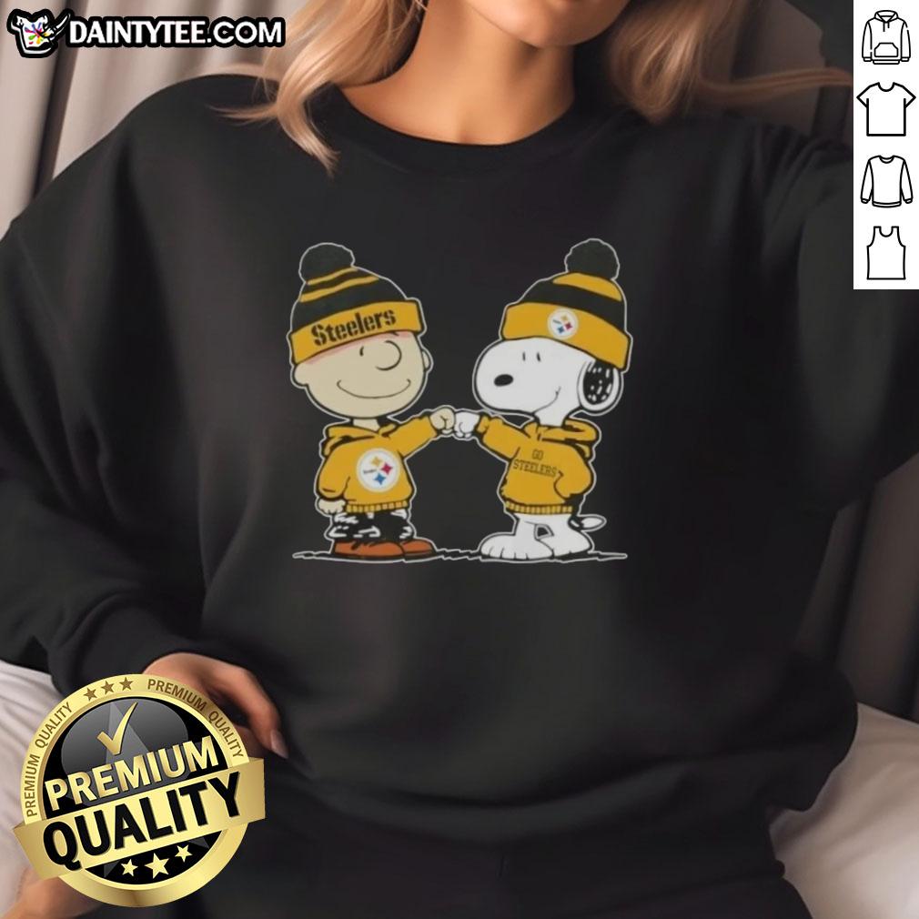 cute-peanuts-charlie-brown-fist-bump-snoopy-x-pittsburgh-steelers-football-sweatshirt Alt Text: Cute Peanuts Charlie Brown and Snoopy fist bump in Pittsburgh Steelers football sweatshirt design.