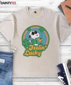 Alt Text: Cute Peanuts Shamrock Feeling Lucky washed t-shirt featuring Charlie Brown and Snoopy in festive green design.