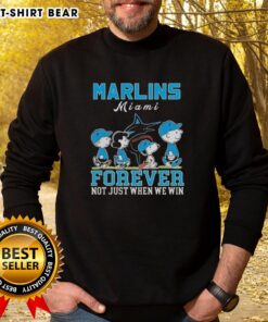 Alt Text: Cute Snoopy and Charlie Brown sweatshirt celebrating Miami Marlins baseball, perfect for fans year-round.