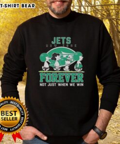Alt Text: Cute Snoopy and Charlie Brown in New York Jets sweatshirt, showcasing Forever Not Just When We Win slogan.