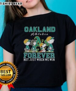 Alt Text: Cute Snoopy and Charlie Brown graphic on Oakland Athletics baseball tee, celebrating fandom beyond winning.