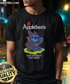 Adorable Stitch cosplay wearing a Toothless X Applebees 'Stay Different Stay Weird' T-shirt, perfect for quirky fans.