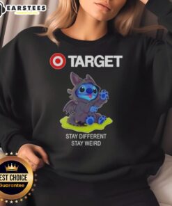 Adorable Stitch cosplay wearing a Toothless-themed sweatshirt from Target, promoting 'Stay Different, Stay Weird' slogan.