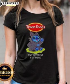 Cute Stitch cosplay wearing a Toothless-themed tee from Tyson Foods, promoting 'Stay Different, Stay Weird' message.